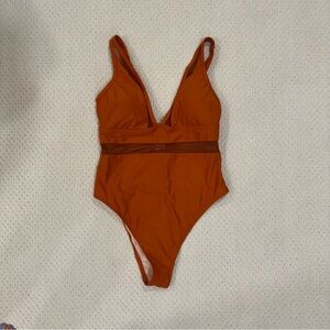 Burnt orange one piece swimsuit with mesh detailing